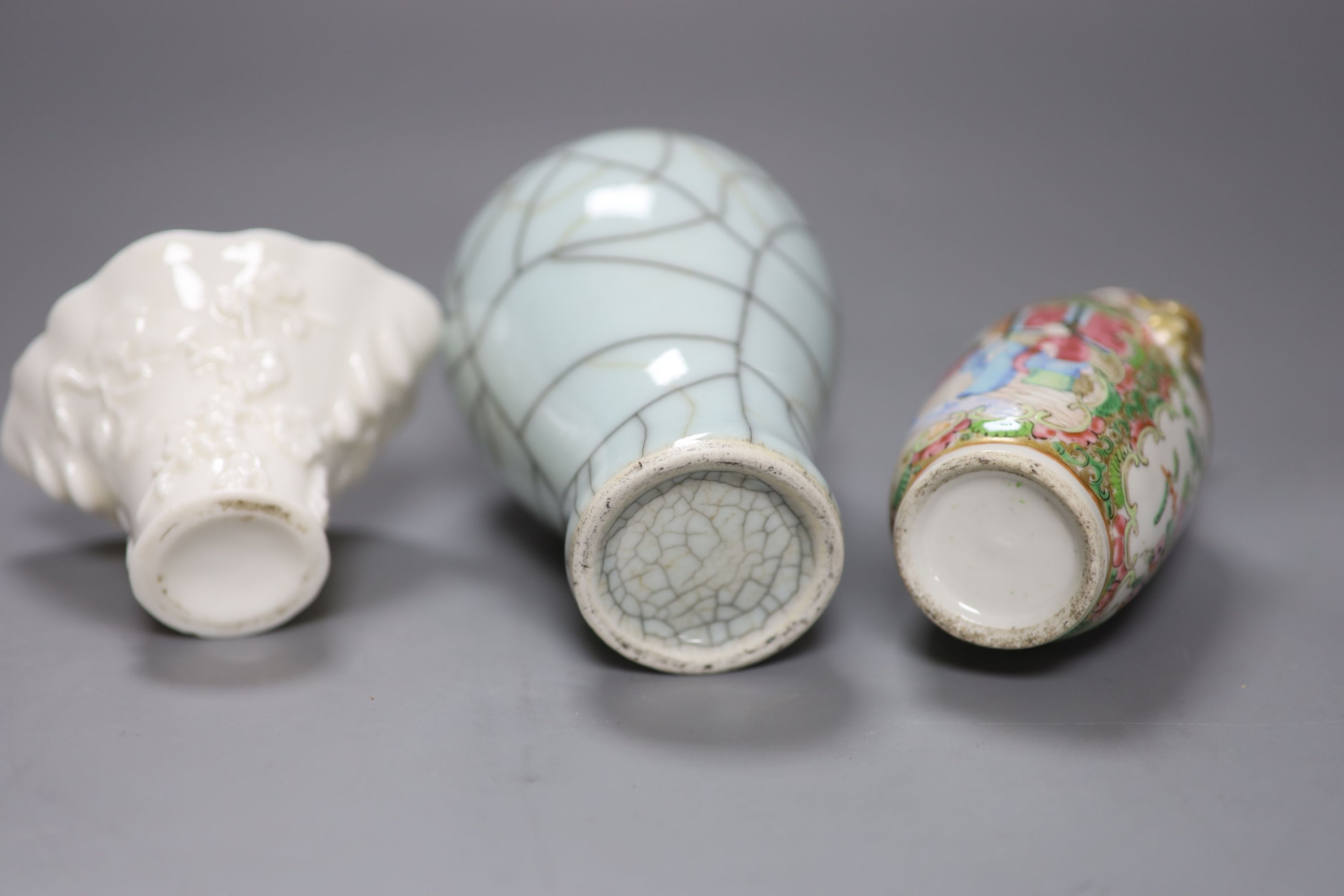 A Chinese white glazed libation cup, a similar famille rose vase and a crackle glaze vase, tallest 16cm